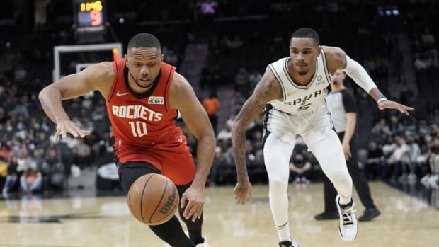 Jan 12, 2022; San Antonio, Texas, USA; Houston Rockets guard Eric Gordon (10) and San Antonio Spurs guard Dejounte Murray (5) go after a loose ball during the first half at AT&amp;T Center. Mandatory Credit: Scott Wachter-USA TODAY Sports